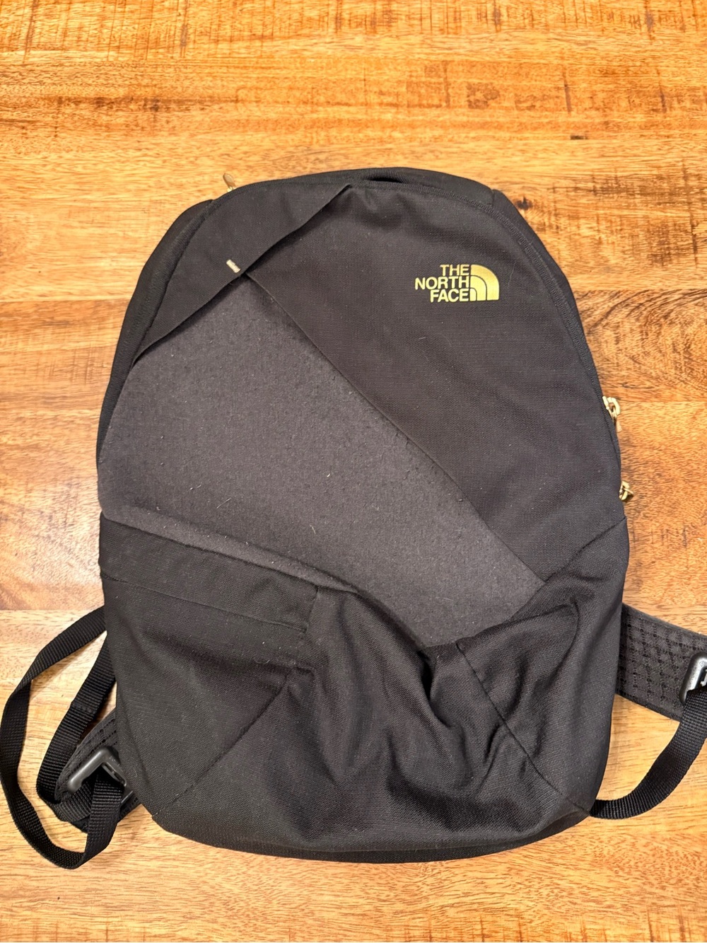The North Face Black Backpack with Yellow Logo
